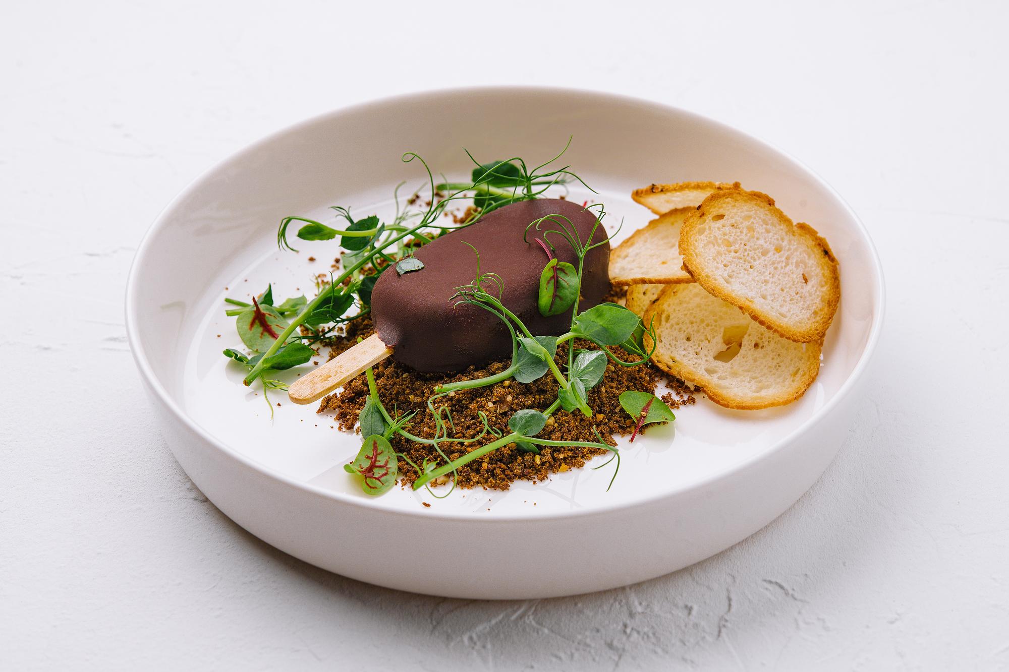Close-up of plated dish with microgreens